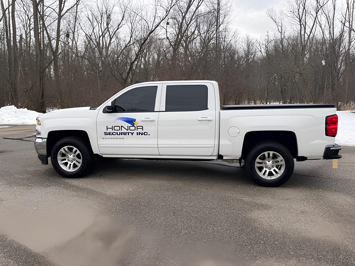 Honor Security Inc branded service pickup truck used for professional security system installation and support.